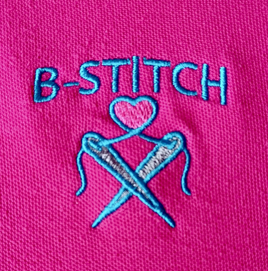 b-stitch embroidered logo on pink polo shirt